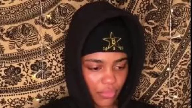 Black cap worn by China Anne McClain in "China Anne McClain reaction to Cameron Boyce death" YouTube video