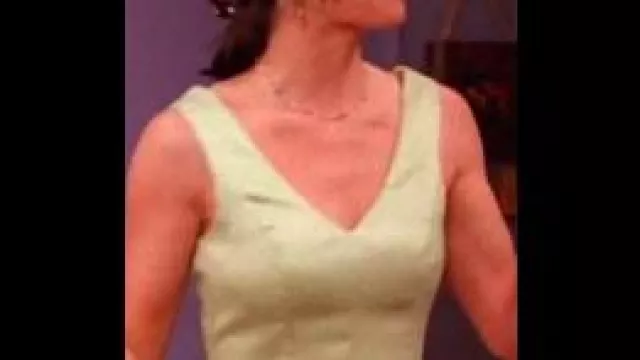 Green v-neck short sleeve party dress of Monica Geller (Courteney Cox) in Friends (S02E22)