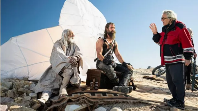 Furiosa : A mad Max Saga: George Miller is wearing a red Parka Jacket on the set on his movie