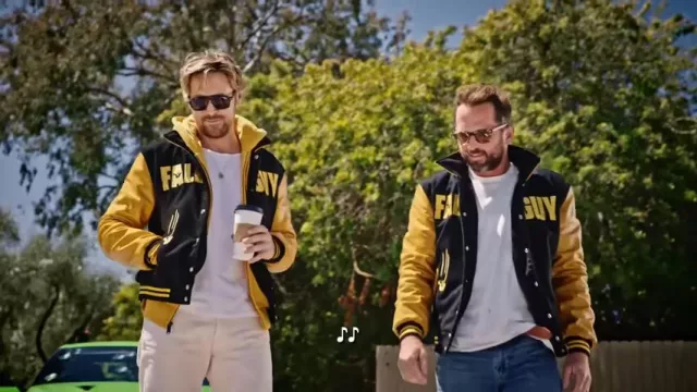 The Fall Guy Outfits: Ryan Gosling is wearing Yellow and Black Varsity Jacket in Ryan Gosling & 'The Fall Guy' Stunt Team Do Carpool Karaoke, IMDB YouTube video on 2024