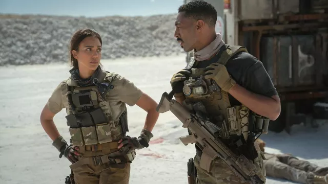 Trigger Warning Outfits: Tone Bell is wearing Tactical Gloves to play Spider in the movie