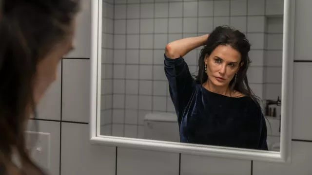 The Substance Movie outfits: Demi Moore wears Navy Blue Velvet Dress to  play Elizabeth Sparkle | Spotern