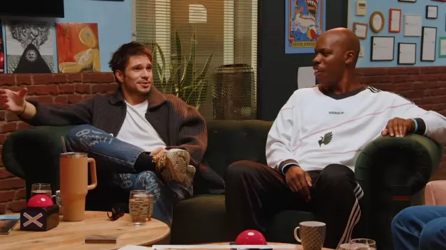 François Civil wears jeans printed with logos in the YouTube video The beatbox world champions give us a blind test and it's (insert adjective such as "sublime")